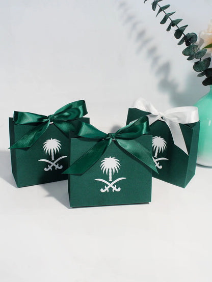 Green gift box with a palm tree design, perfect for celebrating Saudi National Day.