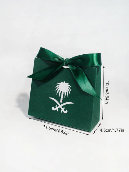 Green gift box with a palm tree design, perfect for celebrating Saudi National Day.