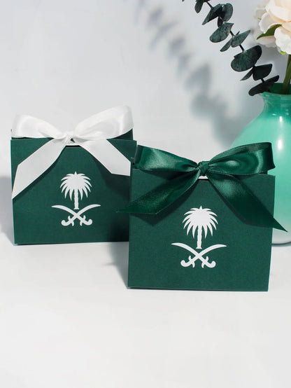 Green gift box with a palm tree design, perfect for celebrating Saudi National Day.