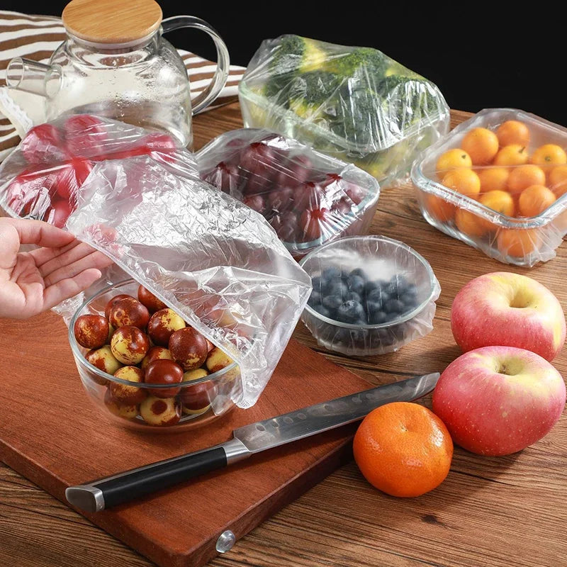 100pcs Elastic Disposable Food Covers: Plastic wrap lids for fruit bowls, cups, and kitchen storage. Fresh-keeping saver bags.